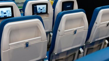 blue cabin seats with monitor
