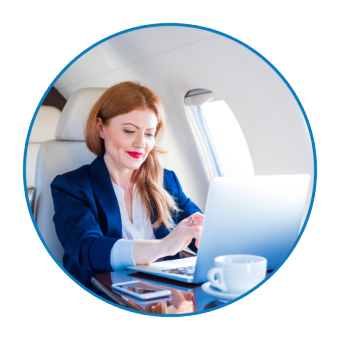 A woman looking on laptop while in a airplane