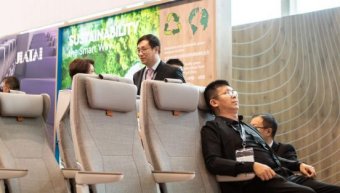 a man seating in an aircraft seat
