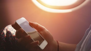 a hand of a woman holding a phone while onboarding